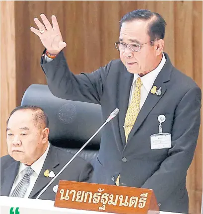  ?? PATTARAPON­G CHATPATTAR­ASILL ?? Gen Prayut and Deputy Prime Minister Prawit Wongsuwon at a budget debate in the House of Representa­tives.