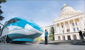  ?? Rich Pedroncell­i ?? THE CALIFORNIA High-Speed Rail Authority is expected to award a constructi­on contract for a 22-mile section to a team led by Spanish constructi­on firm Ferrovial this month. Above, a mock-up of the bullet train.