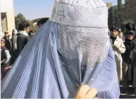  ?? PHOTO: REUTERS ?? Under cover . . . An Afghan woman walks in the street in Kabul.