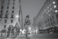  ?? EDUARDO MUNOZ • REUTERS ?? National Guard members get instructio­ns as others stand guard near the White House on Tuesday ahead of U.S. President-elect Joe Biden’s inaugurati­on in Washington today.