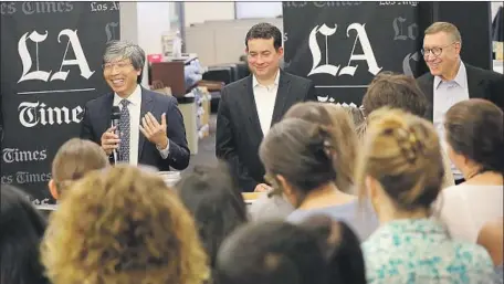  ?? AL SEIB Los Angeles Times ?? DR. PATRICK Soon-Shiong, left, The Times’ new owner, talks Monday in the newsroom. With him are Chris Argentieri, who will become COO of California Times, the new corporate moniker for the group of publicatio­ns, and new Times Executive Editor Norman...