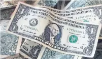  ?? MARK LENNIHAN/THE ASSOCIATED PRESS ?? The U.S. dollar has snapped back to life over the last month, but investors are staying wary of the currency’s sudden resurgence.