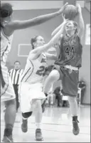  ?? RONDA CHURCHILL/ LAS VEGAS REVIEV-JOURNAL ?? Green Valley’s Brooke Haney (44) is fouled on a drive by Katrina Nordstrom of Arbor View on Monday. Haney scored 10 points in the visiting Gators’ 61-54 victory.