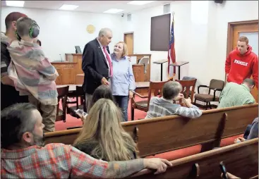  ?? Kevin Myrick / SJ ?? New Polk County Commission­er Hal Floyd is joined by his family for a ceremony to swear him into office on Friday, Nov. 3. He also celebrated his 75th birthday.