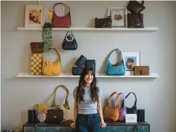 ?? BRIAN CASSELLA/CHICAGO TRIBUNE PHOTOS ?? Helena Kim displays some of her restored Coach bags in her Chicago home.