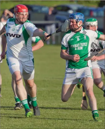  ??  ?? Jason Redmond of Arklow Rock Parnells tries to halt the progresss of Avondale’s Shane Byrne.