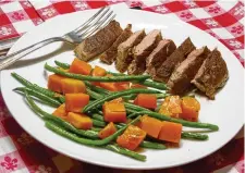  ?? LINDA GASSENHEIM­ER/ TNS ?? Sweet and Spicy Pork and Roasted Butternut Squash and Green Beans.