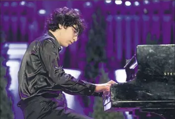  ??  ?? Fourteen-year-old pianist Maxim Lando, a graduate of the Lang Lang Internatio­nal Music Foundation, will share a bench with Lang Lang in his performanc­e at the PSO's opening Gala concert.