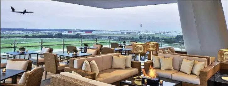  ?? Picture: Solis ?? The Overdrive lounge at the Porsche Experience Centre in Atlanta, US, allows guests to watch cars – and airplanes – from a hotel deck.