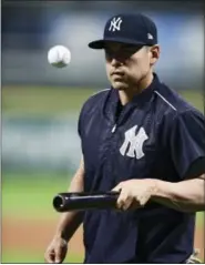  ?? DAVID DERMER — THE ASSOCIATED PRESS ?? New York Yankees’ Jacoby Ellsbury bounces a ball on his bat during a team workout, Wednesday in Cleveland. The Yankees will play the Cleveland Indians in Game 1of the ALDS on Thursday.