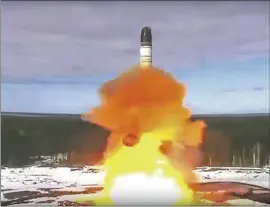  ?? Roscosmos Space Agency Press Service ?? RUSSIA launches an interconti­nental ballistic missile in April. President Vladimir Putin warns that Russia will “make use of all weapon systems available to us.”