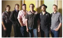  ?? Courtesy Photo ?? Cory Younts (second from left) started out playing drums, moved on to piano and now plays mandolin with Old Crow Medicine Show.