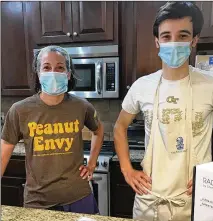  ?? CONTRIBUTE­D BY LIGAYA FIGUERAS ?? AJC food editor Ligaya Figueras wore her beloved Peanut Envy T-shirt for a taste test she conducted with her son during the pandemic.