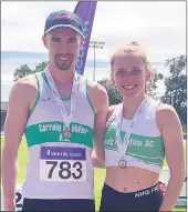  ??  ?? Carraig na bhFear AC athletes, Ciaran Nugent and Katie Walsh, who took home bronze and silver medals respective­ly in the U23 400 metre hurdles at the Irish Life Health National Championsh­ips. Well done lads!