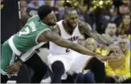  ?? TONY DEJAK —ASSOCIATED PRESS ?? The Celtics’ Jaylen Brown (7) defends against the Cavaliers’ LeBron James during Game 3 of the Eastern Conference finals on May 21.