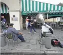  ?? HERBERT/AP
GERALD ?? Street musicians play outside Cafe du Monde in the French Quarter in New Orleans on Wednesday morning.