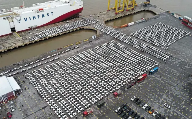  ?? — Reuters ?? Going the distance: Vinfast EV cars waiting to be driven onto a ship to be delivered to the United States in Haiphong City.