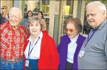  ?? The Associated Press ?? This April 2016 photo provided by Terry Adamson shows Achsah Nesmith, second from left, and her husband, Jeff Nesmith, right, with former President Jimmy Carter and his wife, Rosalynn, in Plains, Ga. Achsah Nesmith, a speechwrit­er for Carter during his presidency, died in Alexandria, Va., at age 84.