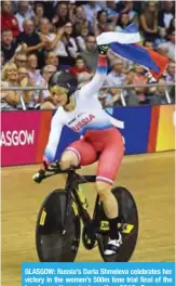  ??  ?? GLASGOW: Russia’s Daria Shmeleva celebrates her victory in the women’s 500m time trial final of the track cycling during the 2018 European Championsh­ips in Glasgow. — AFP