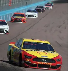  ?? GETTY IMAGES ?? OUT IN FRONT: Joey Logano, driver of the No. 22 Shell Pennzoil Ford, leads a pack of cars during the FanShield 500 at Phoenix Raceway on Sunday.