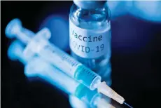 ?? Photo — AFP ?? File photo of a syringe and a bottle reading ‘Vaccine Covid-19’.