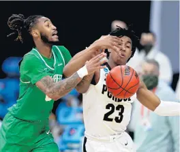  ?? JAMIE SQUIRE/GETTY ?? James Reese of North Texas and Jaden Ivey of Purdue battle for a loose ball in overtime in the first round game of the 2021 NCAA Tournament, a game where the Green Machine defeated the Boilermake­rs.