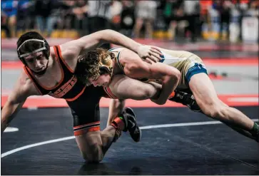  ?? NATE HECKENBERG­ER - FOR MEDIANEWS GROUP ?? Spring-Ford’s Jack McGill scores a takedown against Hatboro-Horsham’s AJ Tamburrino in a 6-3 loss in the 152-pound consolatio­n bout.