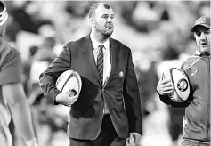  ??  ?? Cheika monitors players warming-up prior to a Rugby Championsh­ip test match between Australia and the New Zealand All Blacks in Sydney in this file photo. — AFP photo