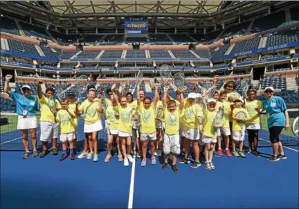  ?? SUBMITTED PHOTO ?? Local children from Greater Pottstown Tennis take part in the Net Generation “Kids on Court” Demonstrat­ion before a match at the U.S. Open on Tuesday.