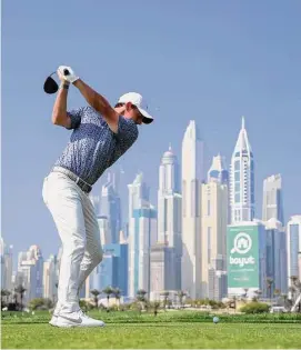  ?? Warren Little/Getty Images ?? Rory McIlroy tees off on the 8th hole during the final round of the Hero Dubai Desert Classic at Emirates Golf Club on Monday in Dubai, United Arab Emirates.