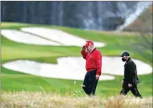  ?? ALEX BRANDON / AP ?? President Donald Trump salutes as he walks to board Marine One after playing golf at Trump National Golf Club Friday in Sterling, Va.