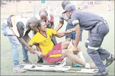  ?? Pic) (File ?? Paramedics assisting Young Buffaloes’ Phiwa Dlamini after he was injured during an MTN Premier League match last season.