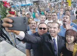  ?? Al Seib Los Angeles Times ?? FORMER L.A. Mayor Antonio Villaraigo­sa, seen taking a self-portrait on Oct. 6, has a nearly 2-to-1 advantage among Latino voters — a key group in his campaign.