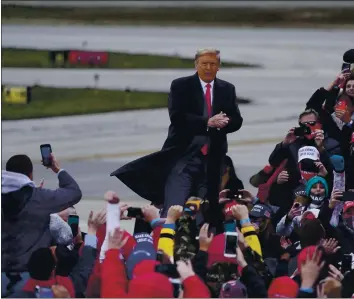  ?? CARLOS OSORIO — THE ASSOCIATED PRESS ?? President Donald Trump arrives at a campaign rally Saturday in Norton Shores, Mich.