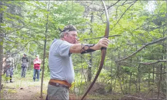  ??  ?? Chris MacFarlane with his old-school longbow.