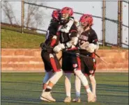  ?? AUSTIN HERTZOG - DIGITAL FIRST MEDIA ?? Boyertown’s Brady McFalls, center, is congratula­ted after scoring a goal in the first half against Owen J. Roberts.