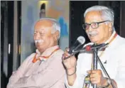  ??  ?? ■ RSS general secretary Suresh 'Bhaiyyaji' Joshi (right) speaks after his reelection in Nagpur on Saturday as the organisati­on’s chief, Mohan Bhagwat, looks on. PTI PHOTO
