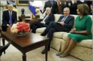  ?? THE ASSOCIATED PRESS ?? President Donald Trump pauses during a meeting with, from left, Senate Majority Leader Mitch McConnell, R-Ky., Senate Minority Leader Chuck Schumer, D-N.Y., House Minority Leader Nancy Pelosi, D-Calif., and other Congressio­nal leaders in the Oval...