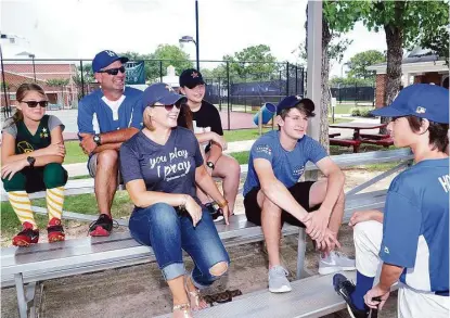  ?? Eddy Matchette / For the Chronicle ?? Youth sports is a major part of life in Fairfield. Before a game, Cole Howell, right, gets some last-minute encouragem­ent from sister Kate, left, dad David, mom Gini, sister Lily and brother Ben.