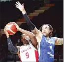  ??  ?? Canada’s RJ Barrett is defended by Czech Republic’s Blake Schilb during the second half of a semifinal in the FIBA men’s Olympic basketball qualifying tournament, on July 3, in Victoria, British Columbia. (AP)