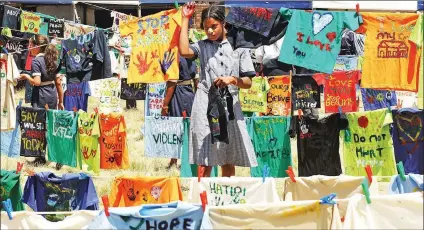  ??  ?? EXPOSING THE TRUTH: During last year’s 16 Days of Activism for No Violence Against Women and Children, the Saartjie Baartman Centre hosted an “air your dirty laundry” exercise where children wrote messages on T-shirts and hung them on a line. PIcture:...