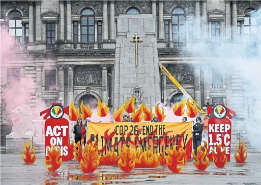  ?? JEFF J MITCHELL GETTY IMAGES PHOTOS ?? Activists will welcome world leaders to COP26 this weekend with a field of symbolic climate fire in George Square in Glasgow, Scotland.