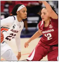  ?? (Photo courtesy of the SEC) ?? Arkansas’ Destiny Slocum (right) defends against Auburn’s Honesty Scott-Grayson during the Razobacks’ victory Thursday night at Auburn, Ala.