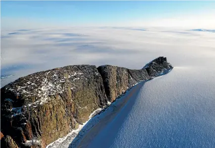  ?? PHOTO: NASA ?? A section of ice sheet is seen from Nasa’s Operation IceBridge research aircraft along the Upper Baffin Bay coast of Greenland. Greenland’s ice sheet is retreating due to warming temperatur­es.