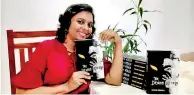  ??  ?? Dilshani Yashoda holding a copy of her book