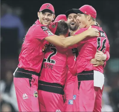  ?? PICTURE: MARK KOLBE/ GETTY IMAGES ?? LIGHT ENTERTAINM­ENT: Sydney Sixers’ players celebrate victory in the Big Bash Final against Melbourne Stars at the SCG in February this year, with the next tournament promising a number of rule changes in the desire to present even more ‘ exciting cricket’.