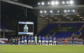  ?? JAN KRUGER,POOL VIA AP ?? Everton and West Ham players commemorat­es COVID-19 victims during the English Premier League soccer match between Everton and West Ham at Goodison Park in Liverpool, England, Friday.