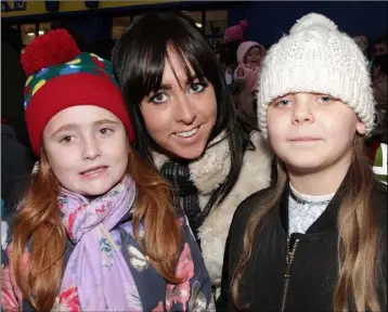  ??  ?? Hannah Cullen, Janice Browne and Erin Barnes at the switching on of the Christmas lights on the Quay on Saturday.