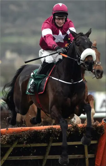  ??  ?? Champagne Classic, ridden by J.J. Slevin, clears the last on the way to winning the Martin Pipe Conditiona­l Jockeys’ Handicap Hurdle at last year’s Cheltenham Festival.