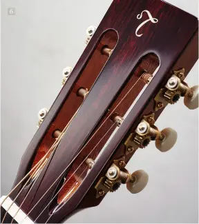  ??  ?? 6 6. The slotted headstock of the EF740FS-TT has open-gear tuners with a bone nut